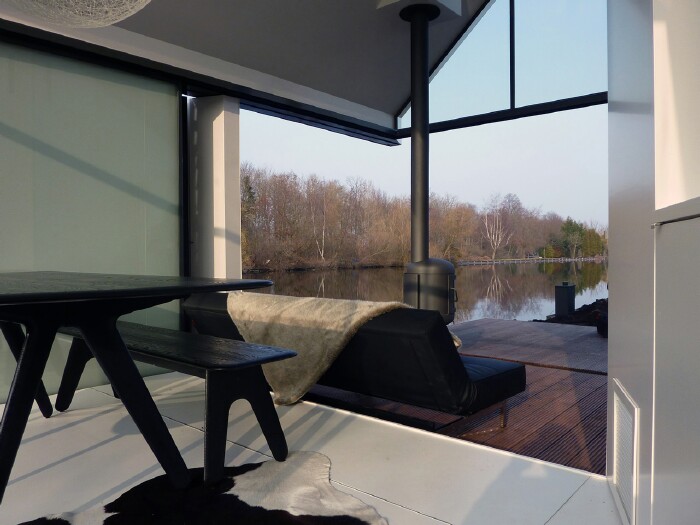 This Tiny Lake House Lets You Dive In For a Swim Right From the Living Room