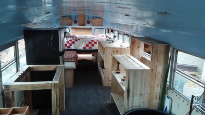 Check Out This Couple’s Fully Converted Blue Bird Bus Home and Office!