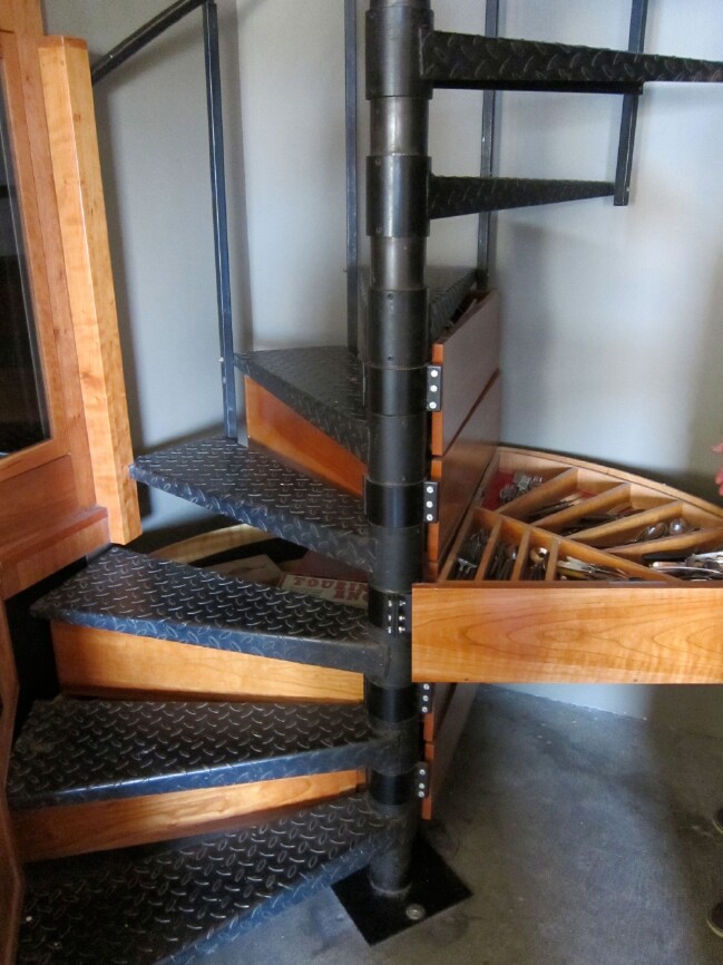 Conceal storage in your spiral staircase.
