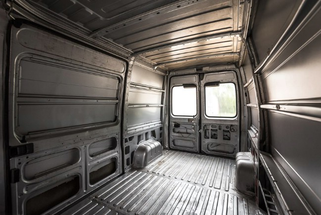 Traveling Photographer Converts Cargo Van into Tiny House