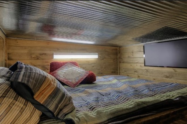 This Shipping Container was Turned into a Rustic Log Tiny House