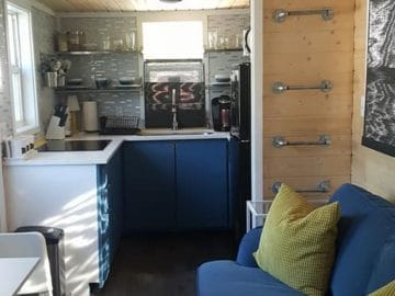 Tiny house living room by kitchen in blue and gray tones