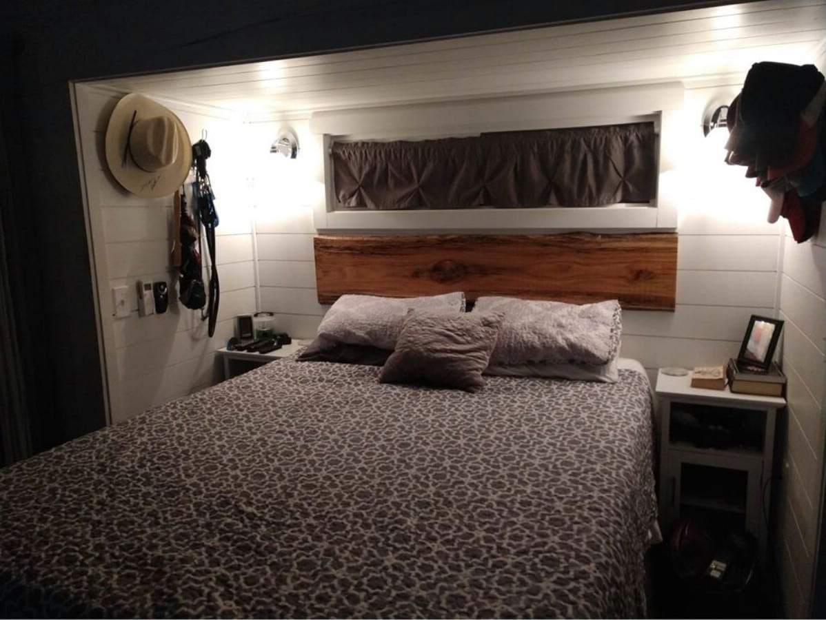 Fully furnished bedroom with wooden backboard