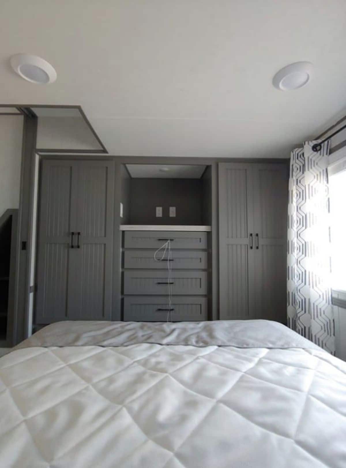 Park Model Homes Tiny House With Ample Storage in the Downstairs Bedroom
