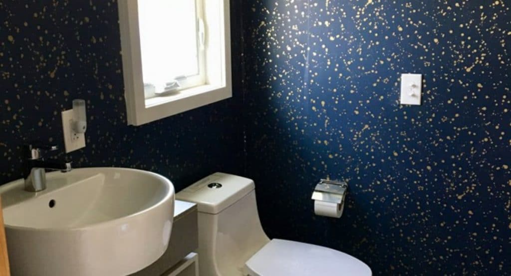 Dark blue galaxy walls in galaxy bathroom