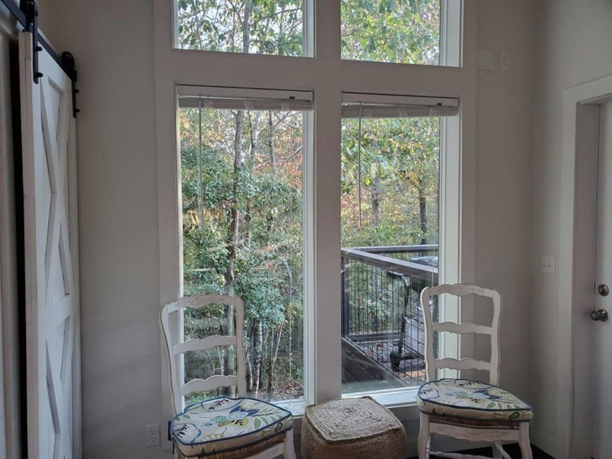 Large windows to wooded area