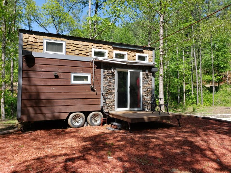 Modern cabin tiny home with mulch yard