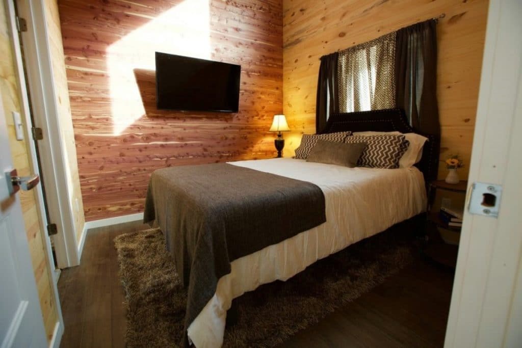 Fairchild bottom floor bedroom with wood walls