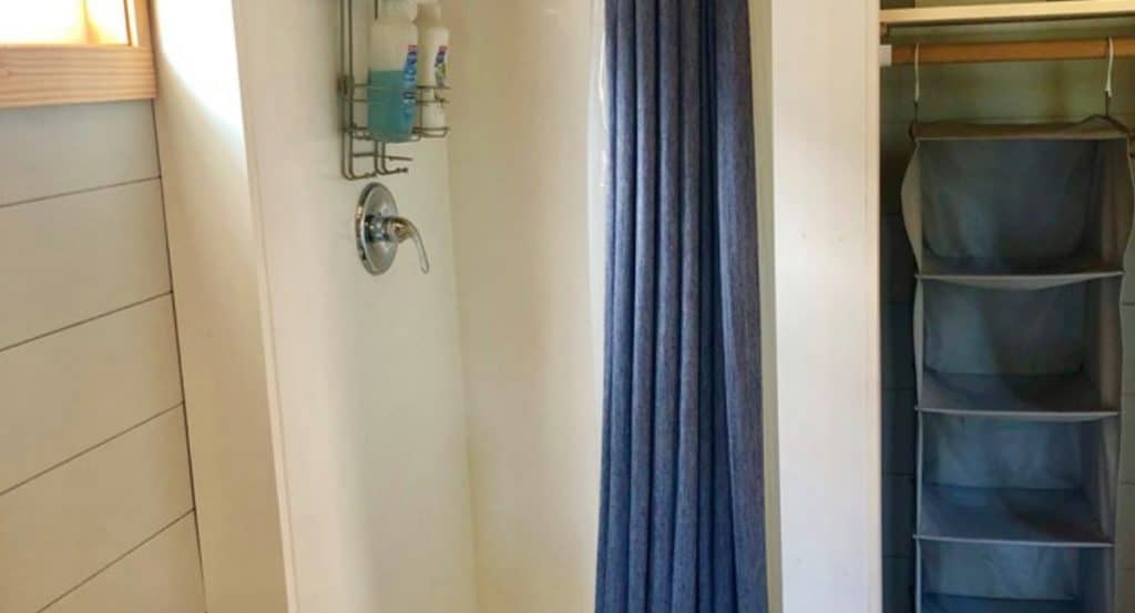 Shower with blue curtain