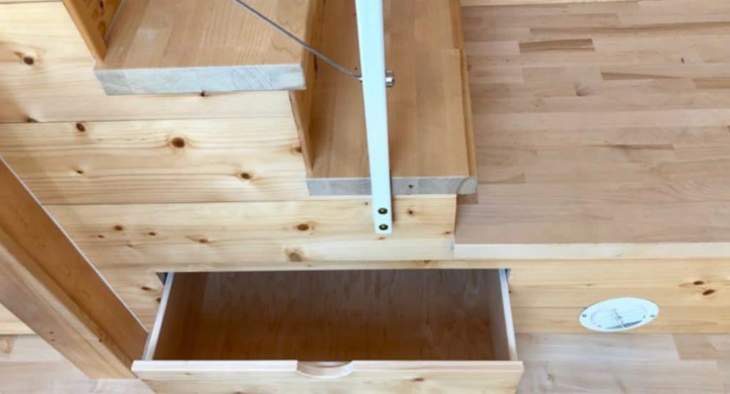 Storage drawers in staircase