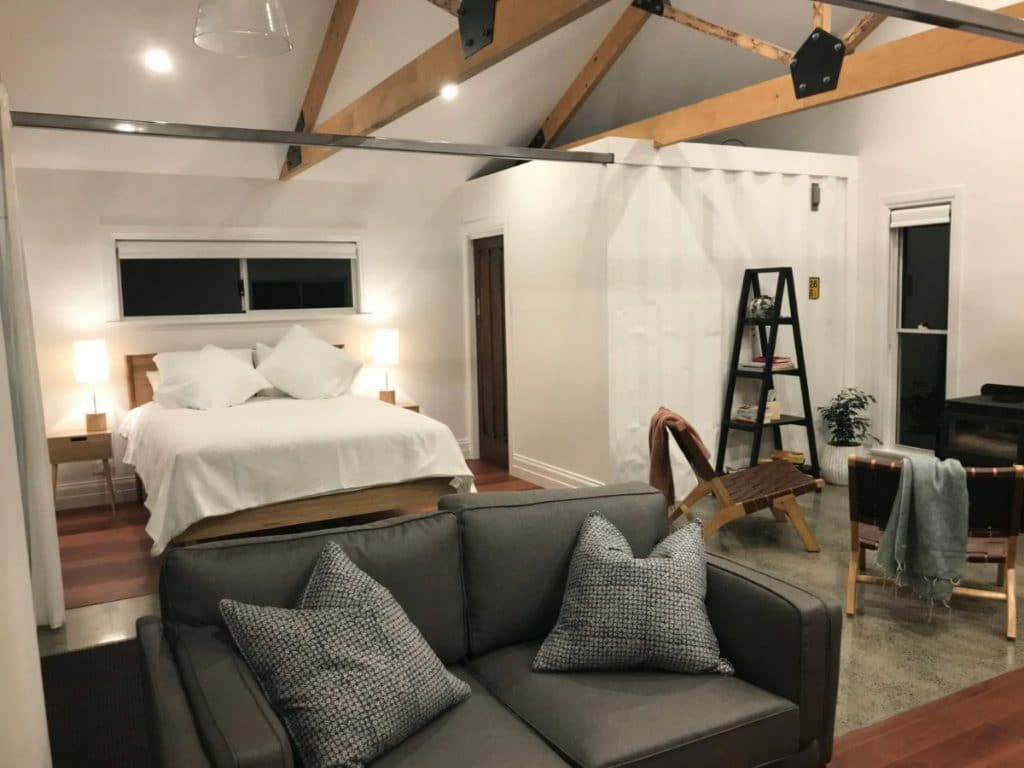 Bed and sofa in tiny container home