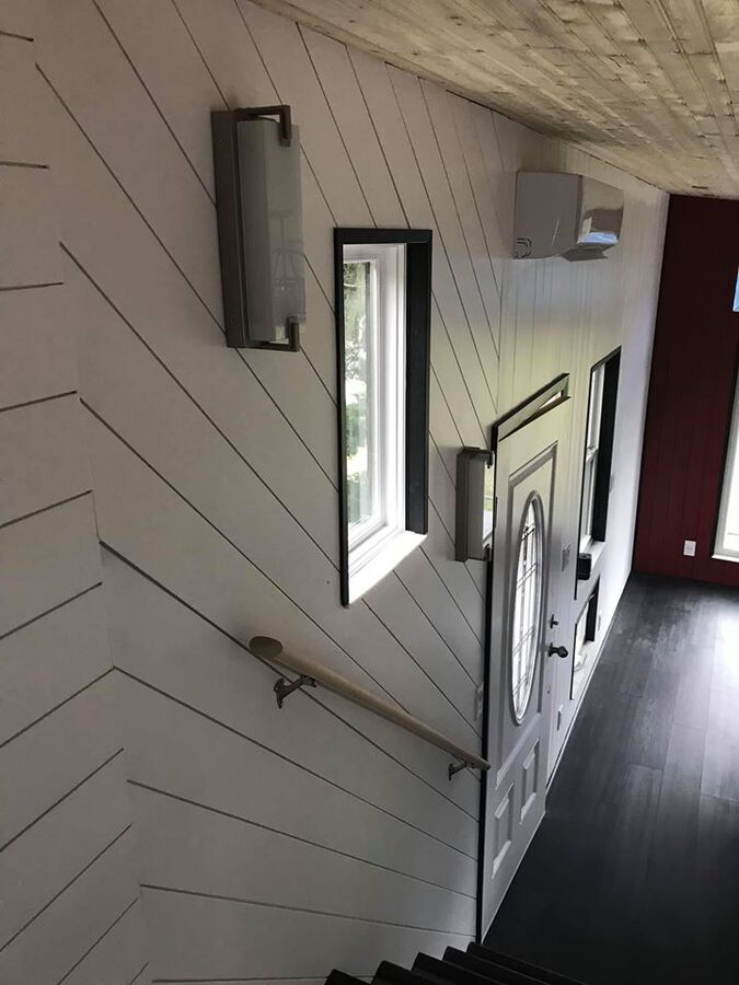 Shiplap wall with stair handrail