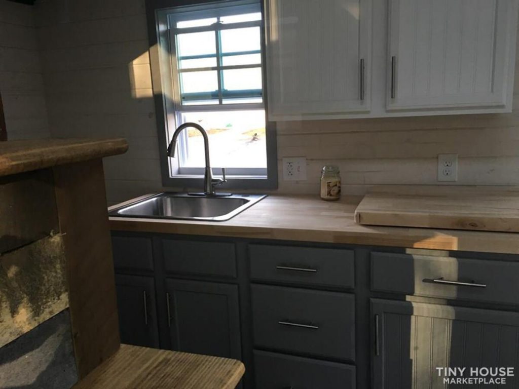 Kitchen with grey cabinets in tiny house