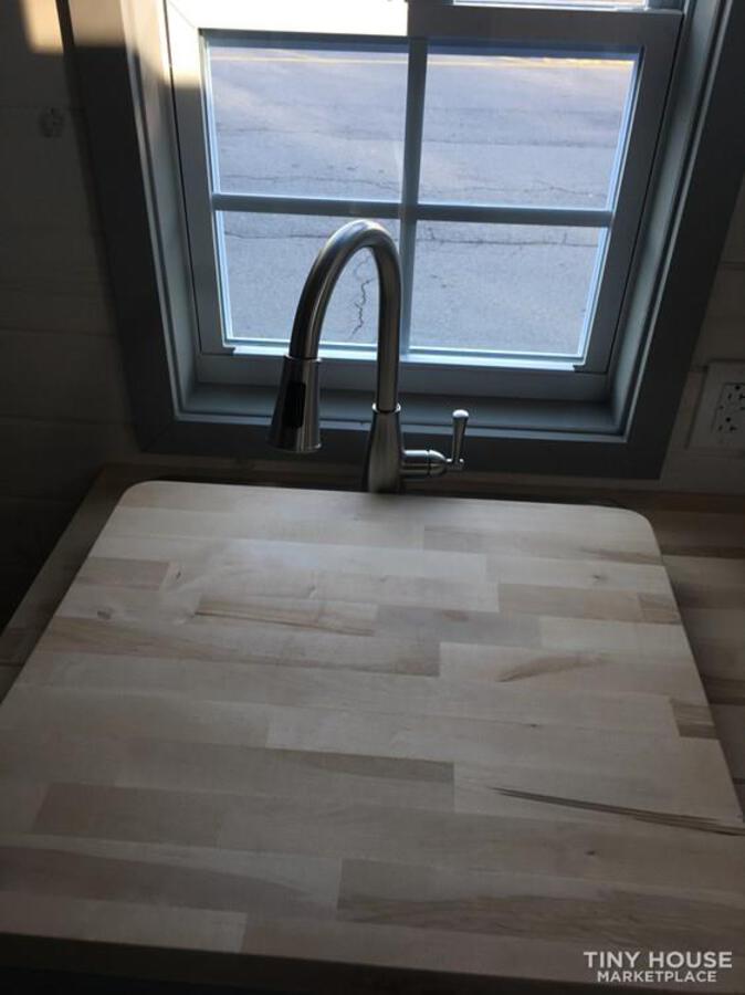 Farmhouse sink with cutting board cupboard