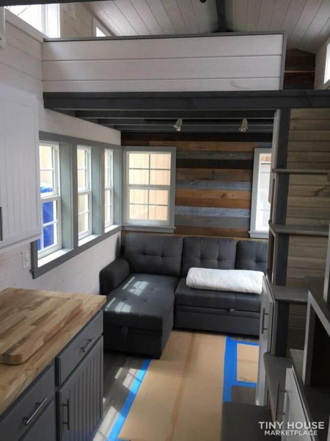 Living room of tiny home with sectional sofa