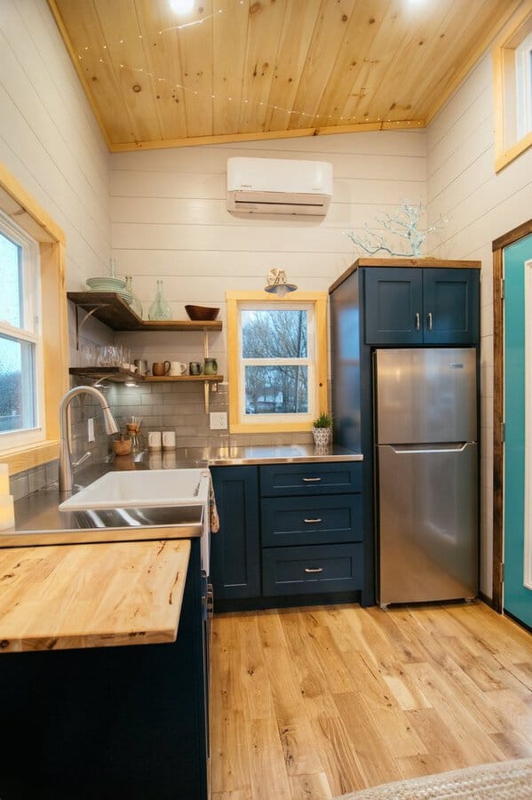 Teal cabinets in tiny house