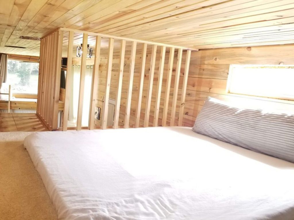 Loft bedroom with wooden railing