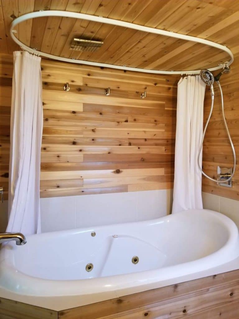 Soaking tub with wooden paneling