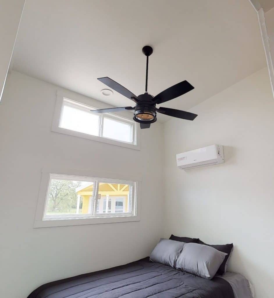 Ceiling fan above bed