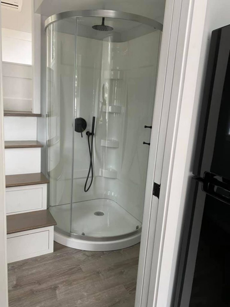 Corner shower in tiny house