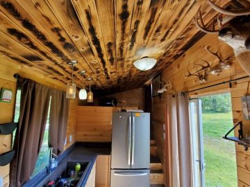 Rustic tiny house cabin with refrigerator