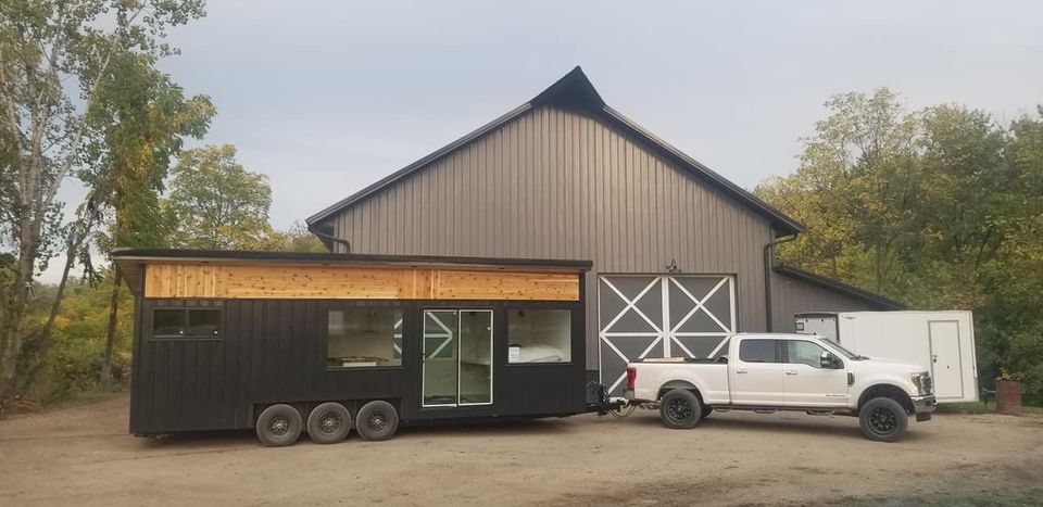 Tiny house in front of garage