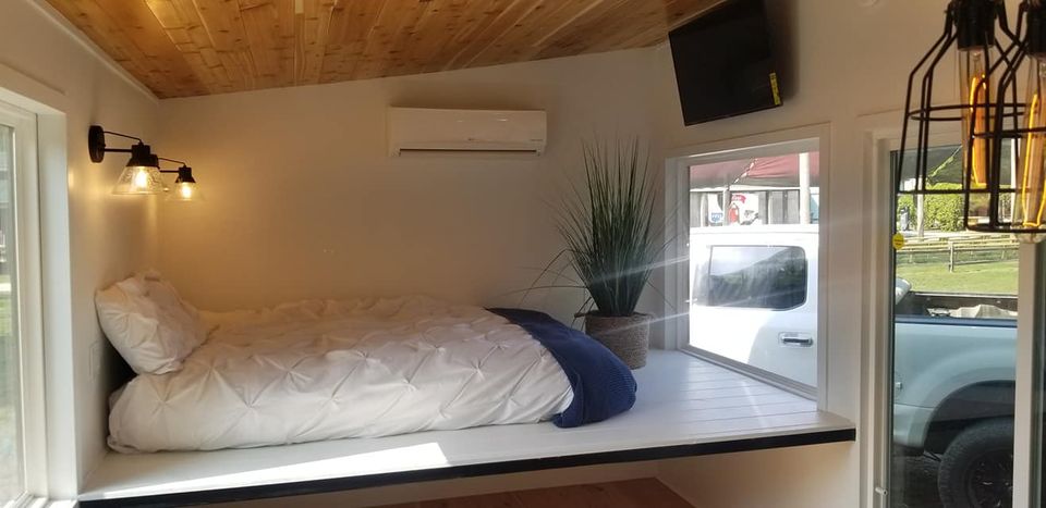 Elevated bed in tiny house