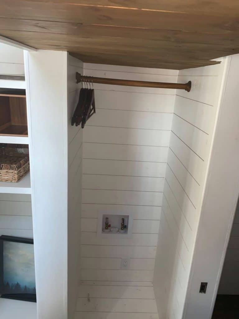 Closet with shiplap wall