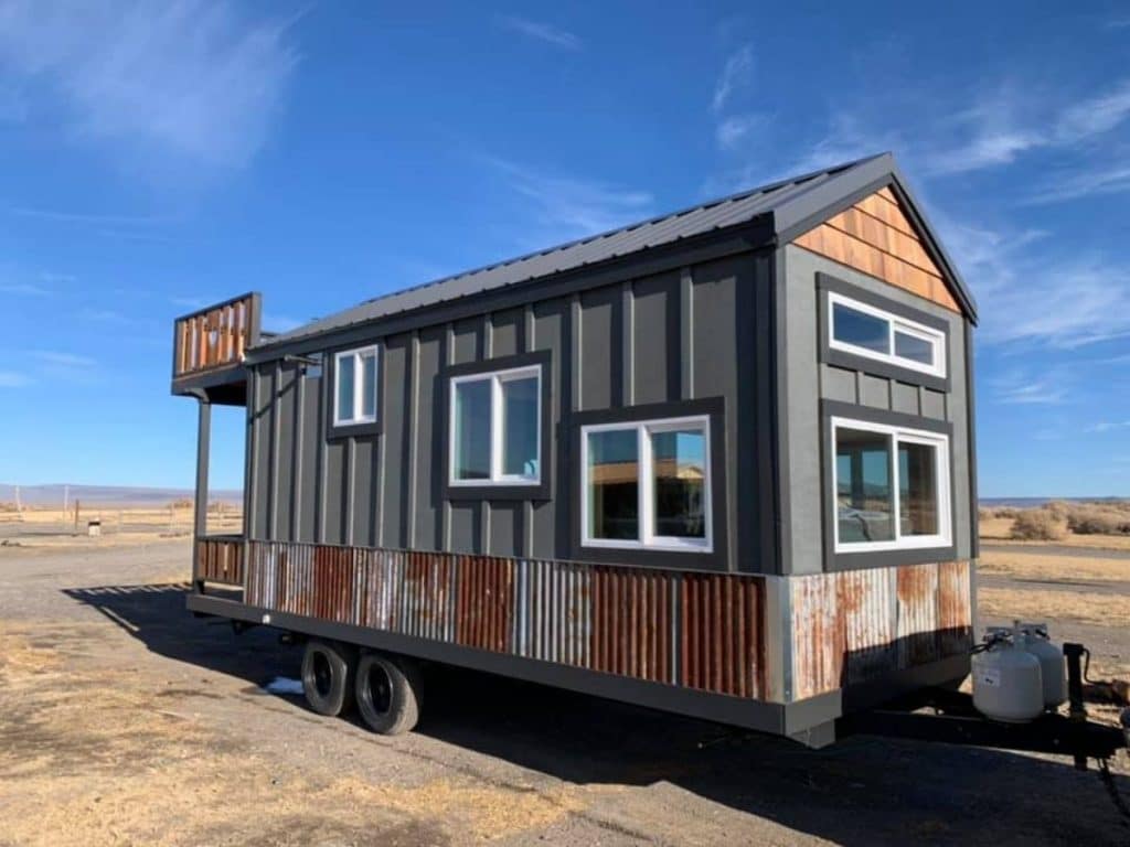 Blue and wood tiny house on wheels