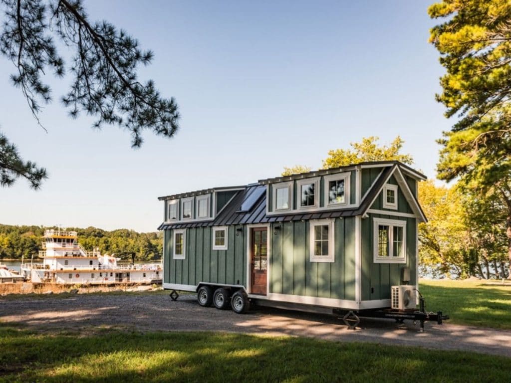 Green tiny house on wheels