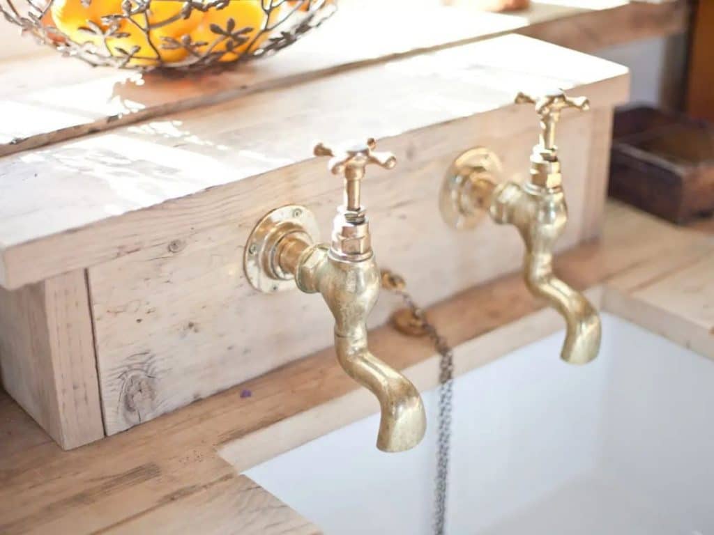 Kitchen sink with brass faucets