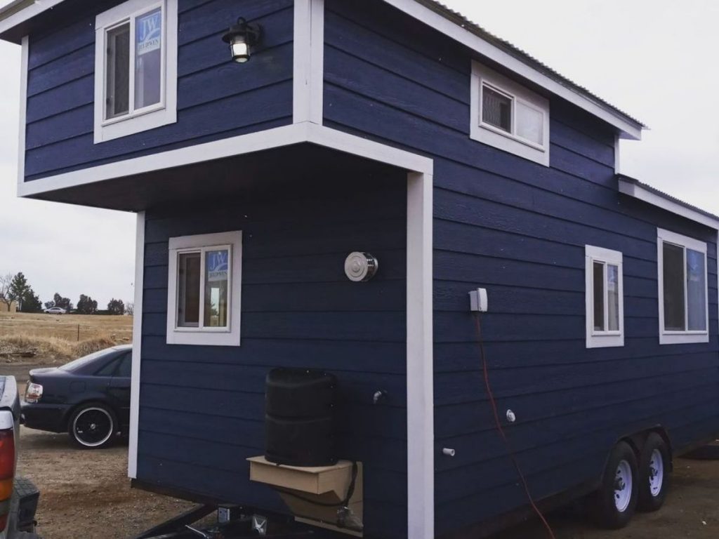 Blue tiny house on wheels