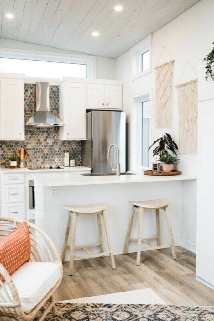 White kitchen with island and bar stools
