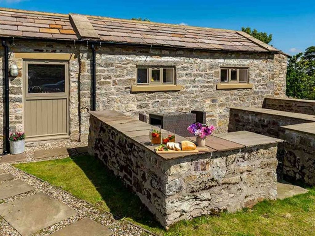 Stone cottage on knoll