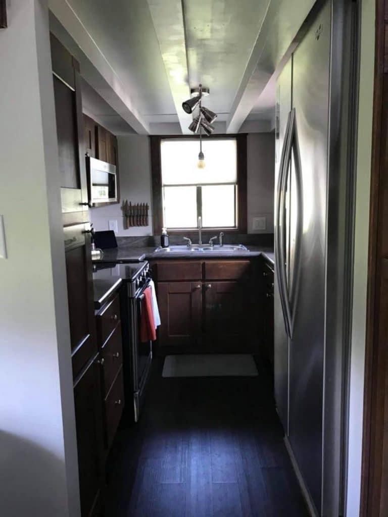 Tiny home kitchen with sink at end of home