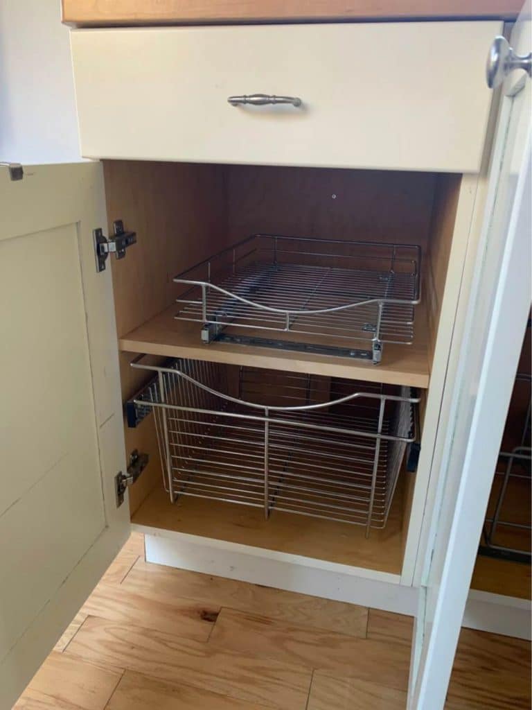 Open drawer with wire baskets inside