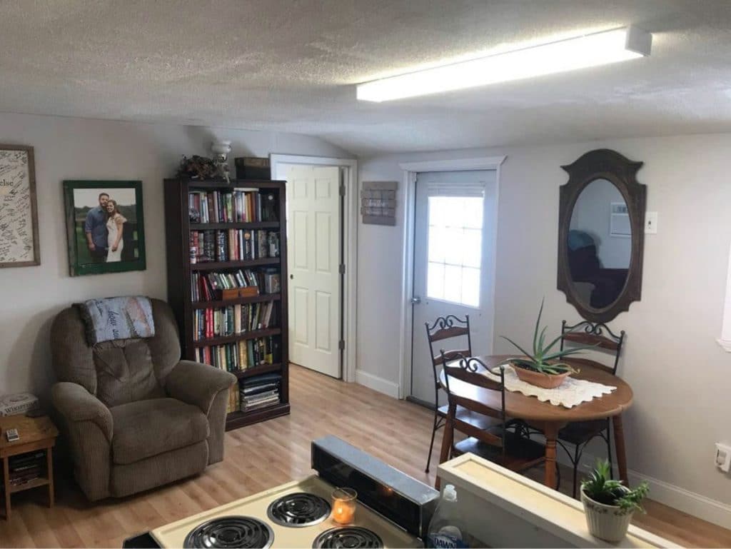 Living space with black bookcase and recliners