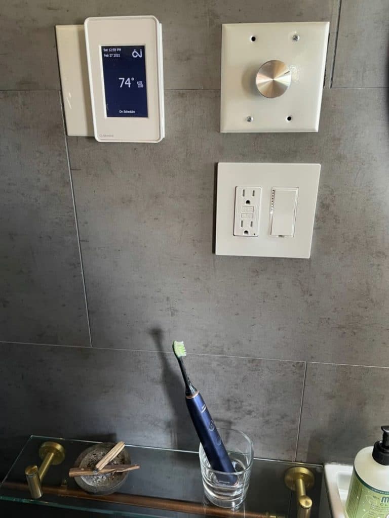 Thermostat above bathroom sink