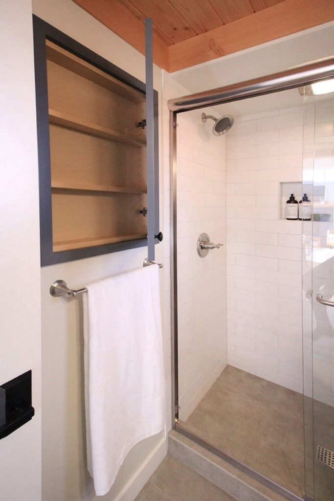 Bathroom shower door with built-in medicine cabinet
