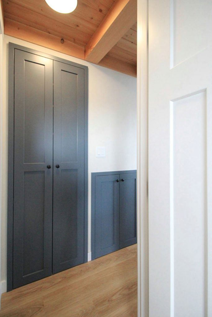 Closed teal doors in hall