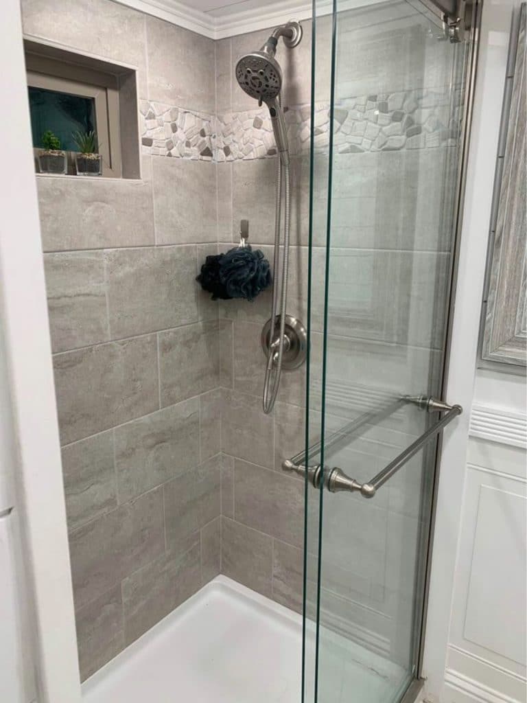 Tiled shower with glass door