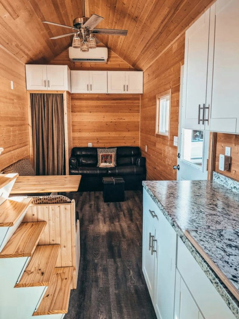 Kitchen counter with stairs opposite in tiny home