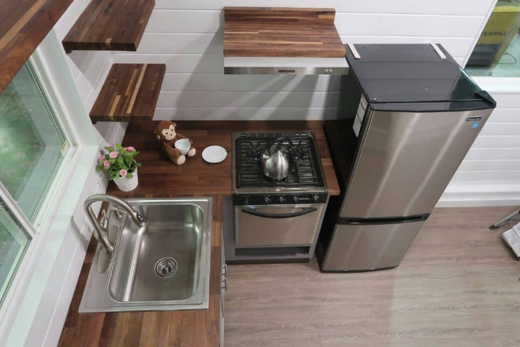 Tiny house kitchen with stainless steel appliances