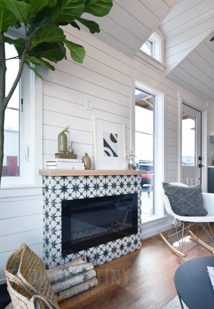 Blue and white tile fireplace with white shiplap above