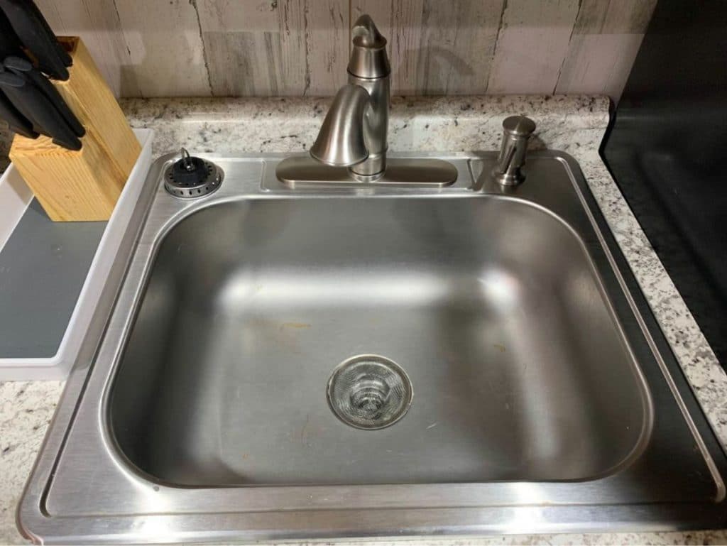 Stainless steel sink inset on kitchen counter