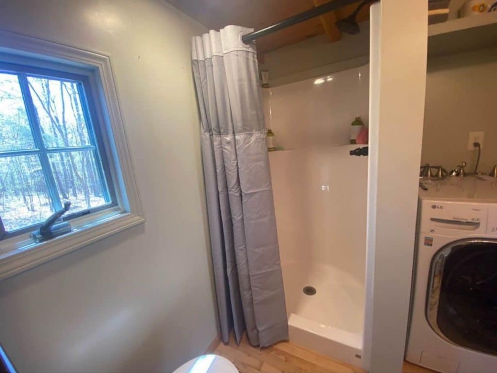 Shower stall with curtain half open