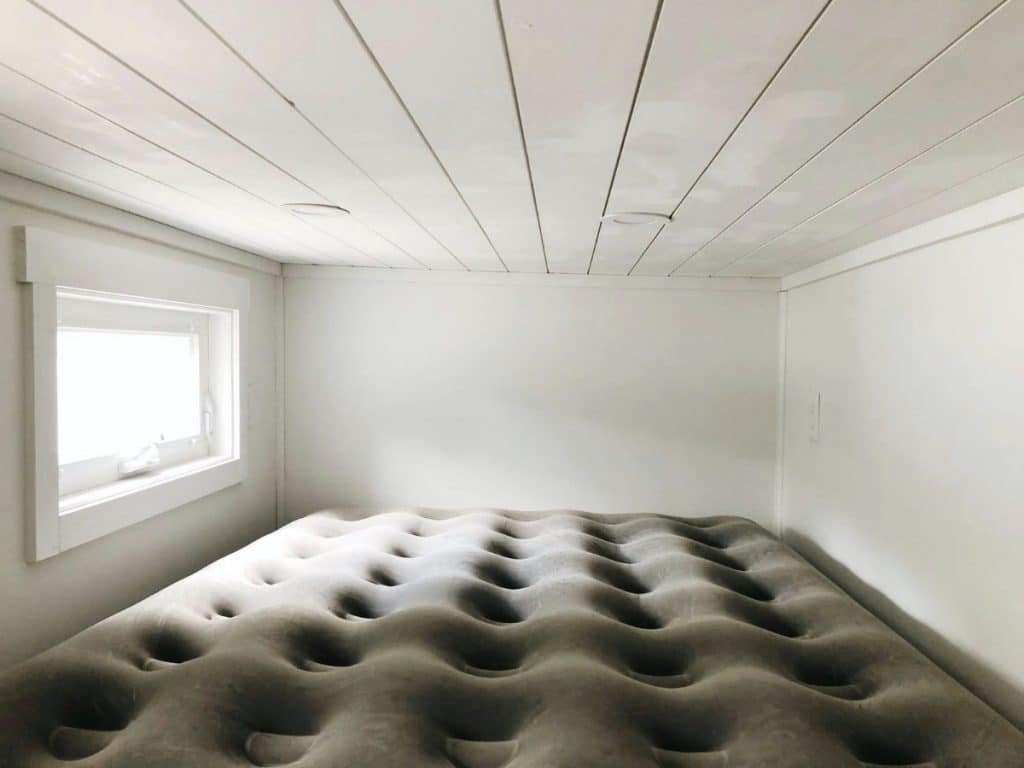 Air mattress in loft sleeping space