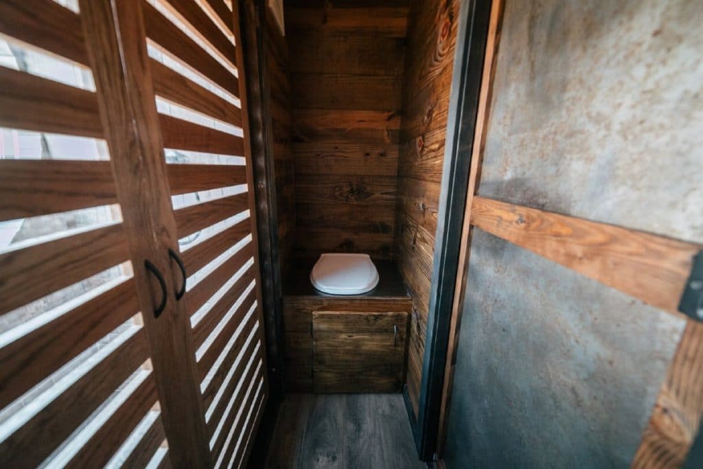 Toilet built into reclaimed wood base
