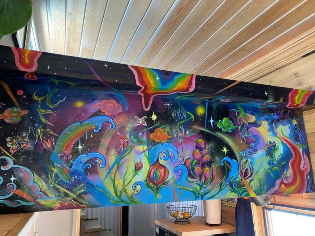 Colorful artwork on wall to loft