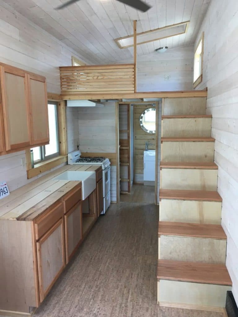 View of interior tiny house with natural wood
